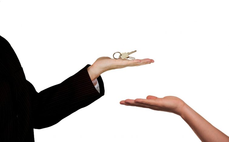 Real Estate Agent Sale Home Keys Hand Handing